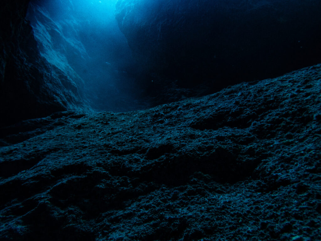 Moonscape at the bottom of the Chimney in Niue. This was taken at around 28m depth. THe light is daylight